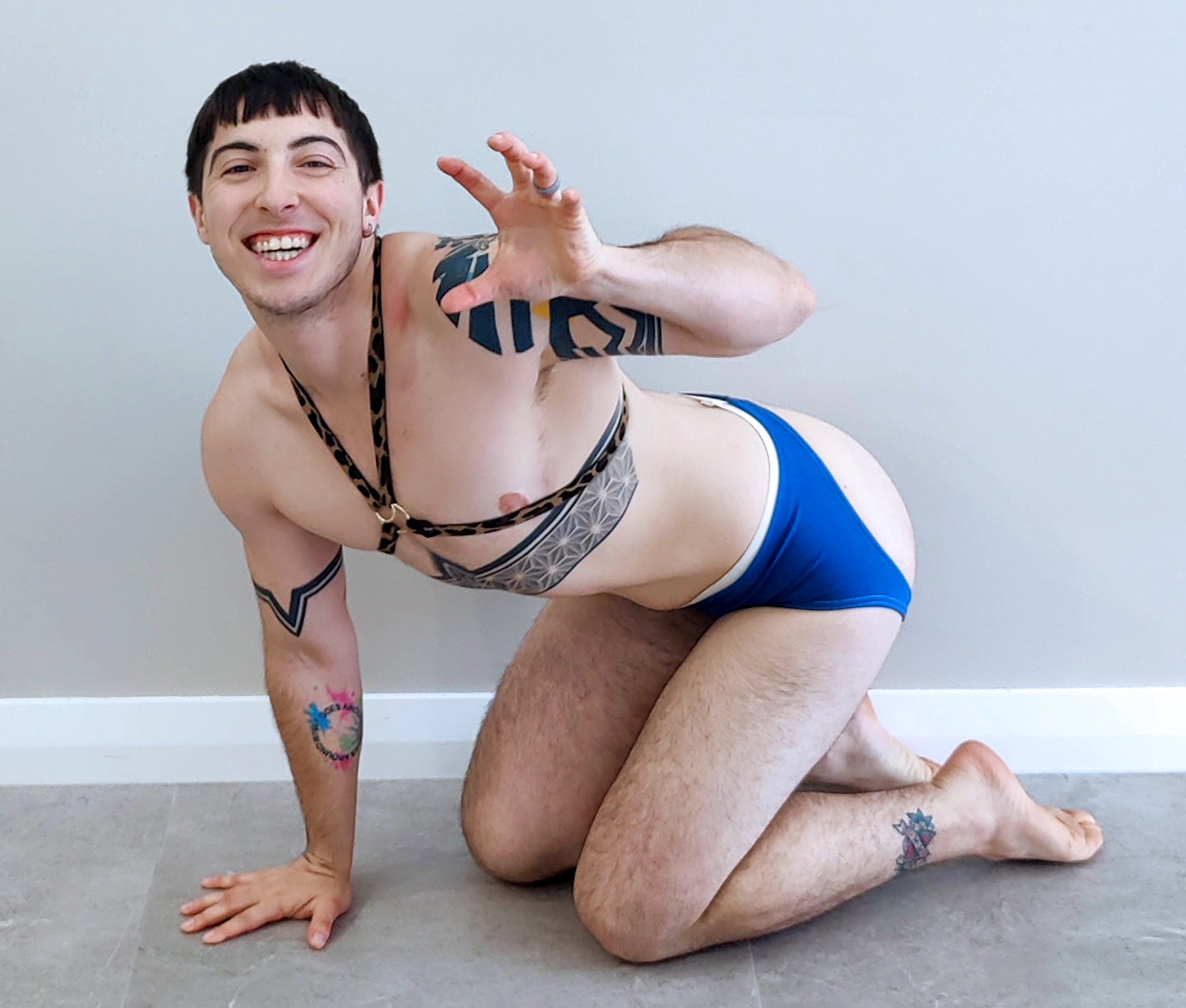 Person wearing a queer body harness