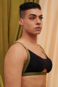 A tansgender model wears a custom sustainable bamboo bra and panty set. 