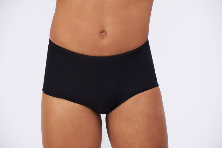 Detail of a mtf transgender compression gaff with a boyshort cut, photographed from the front. 