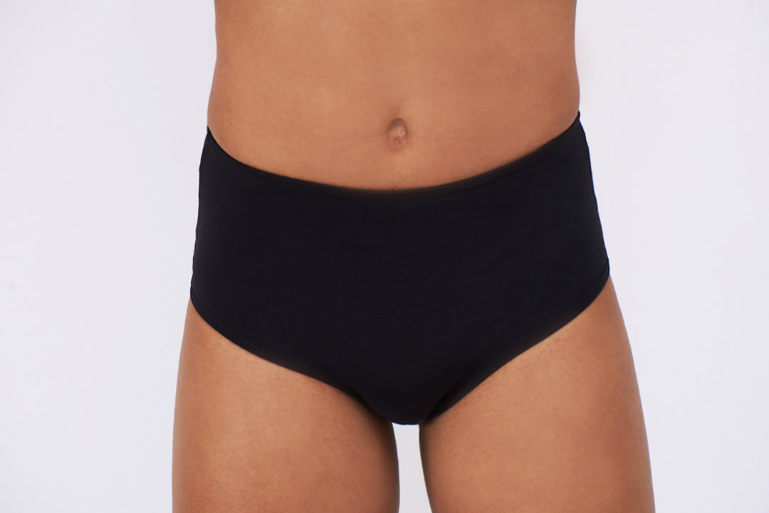 Detail of a mtf transgender compression gaff with a ckeey boyshort cut and sheer back, photographed from the front.
